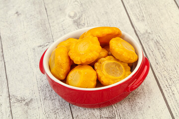 Marinated yellow patisson in the bowl