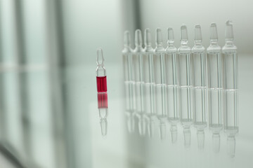 Glass ampoules on a glass table