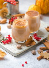 Pumpkin latte in a glasses. Autumn drink for Halloween or Thanksgiving.