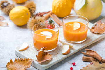 hot pumpkin punch or sangria in a glass with apple. Halloween and Thanksgiving beverage. Traditional autumn, winter drinks and cocktails