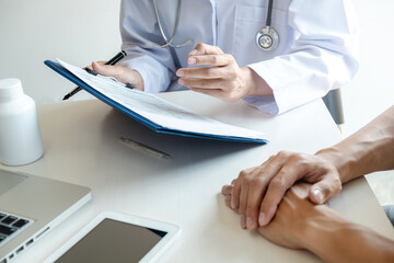 Senior doctor and patient meeting in hospital.