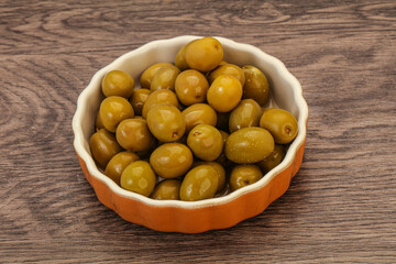 Green pickled olives in the bowl