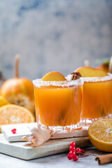 pumpkin punch or sangria in a glass with apple, cinnamon. Halloween and Thanksgiving. Traditional autumn, winter drinks and cocktails