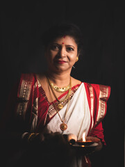 A Woman wearing red and white saree stock image.
