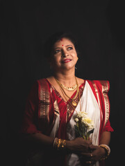 A Woman wearing red and white saree stock image.