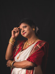 A Woman wearing red and white saree stock image.