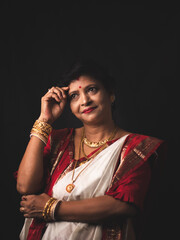 A Woman wearing red and white saree stock image.