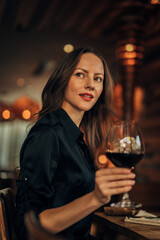 elegant woman drinking red wine