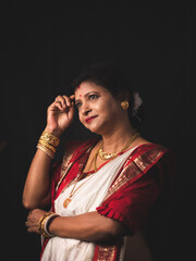 A Woman wearing red and white saree stock image.