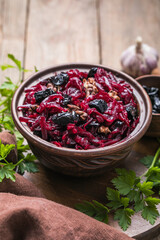 Christmas salad with beets, prunes and nuts