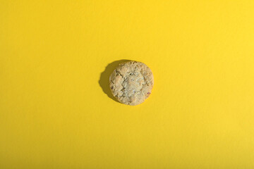 alone cookies on a yellow background.