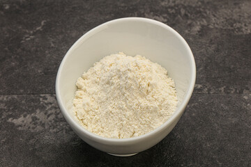 Wheat flour heap in the bowl