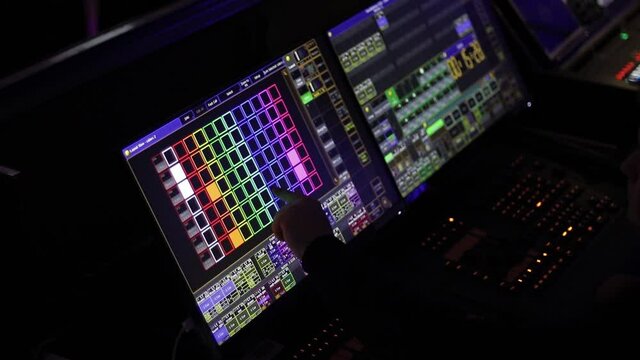 Audio mix desk at a concert. Man working on professional digital audio channel mixer in studio. Male Dj hands playing set in night club party slow motion