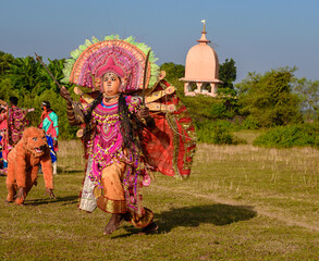 A Chhau Dancer performing as Goddess Durga .