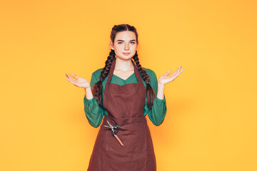 A woman wears a brown apron, a universal service uniform for the population, a uniform for salesmen...