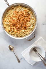 Baked penne pasta with artichokes and cheese