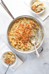 Baked penne pasta with artichokes and cheese