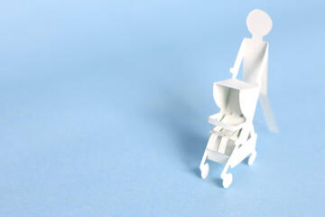 ペーパークラフトのベビーカーと人