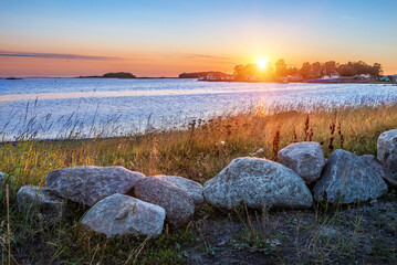 View of ships at the pier and stones on the shores of the Solovetsky Islands