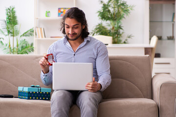 Young man doing marriage proposal via internet