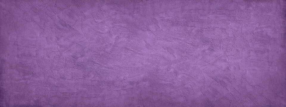 Purple abstract background. Toned texture of rough decorative plaster on a concrete wall. Wide banner. Panorama. Copy space. Nobody. Violet color with a grungy texture.