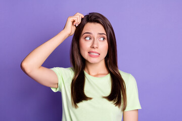 Fototapeta premium Photo portrait of stressed troubled girl nervous looking at empty space isolated on vivid violet color background