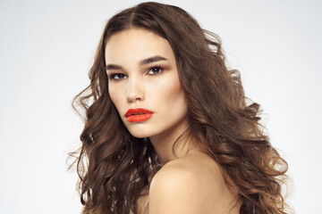 Fototapeta premium Elegant woman with bare shoulders red lips glamor attractive look cropped look