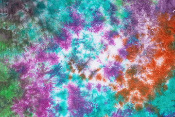 Fototapeta na wymiar tie dye pattern hand dyed on cotton fabric abstract background.