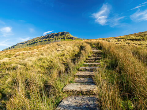 Stone steps up to the mountain of Pen-y-ghent in the Yorkshire Dales National Park. At 2,277 feet, the mountain is one of the 'Three Peaks of Yorkshire'.