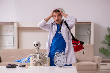 Young male paramedic visiting skeleton patient