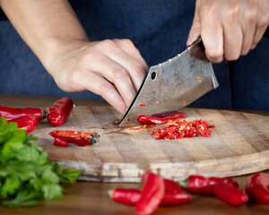 chef cutting pepper