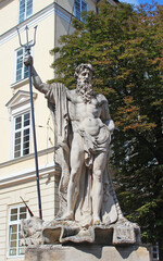 Obraz premium Neptune fountain on Market square in Lviv on Town Hall background. Monument to Poseidon in Lvov. Lviv historic city center is on the UNESCO World Heritage List