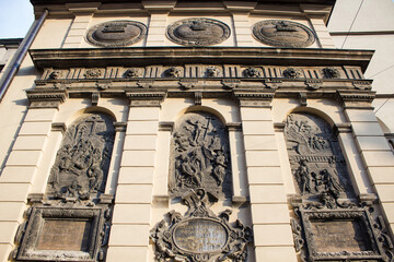 Fototapeta premium Metal triptych on exterior of Cathedral Basilica of the Assumption of the Blessed Virgin Mary (also known as Latin Cathedral) in Lviv, Western Ukraine. Chapel Kampians