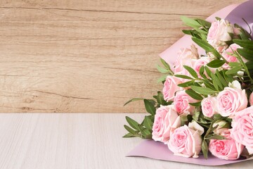 Pink roses on wooden background. Bouquet of pink roses, Floral background image with copy space for text