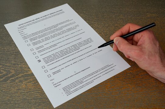 French permission form for trip out of home. France lockdown form for getting out. French attestation paper during covid disease. Fill in permission form during coronavirus lockdown.