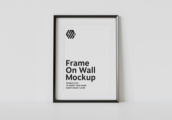Vertical Black Frame Leaning on White Interior Mockup
