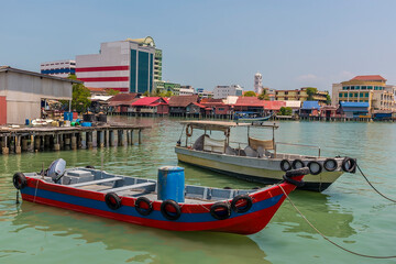 Fototapeta na wymiar Fishing boats moored at the clan jetties in George Town, Penang Island, Malaysia, Asia