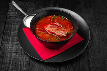 Red borscht beetroot with pork ribs or spicy kharcho soup with garlic. Festive table with delicious food.