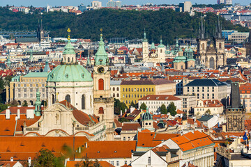Fototapeta na wymiar Prague, Czech republic - September 19, 2020. Famous towers above roofs 