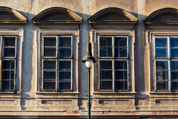 Prague, Czech republic - September 19, 2020. Architectonic details of building in Pohorelec street - old windows with street lamp of Slikuv palace
