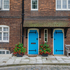 Fototapeta na wymiar old house with blue doors