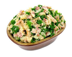 Traditional Irish Colcannon in a rustic earthenware dish, Colcannon is made with mashed potato and kale or cabbage, isolated on a white background