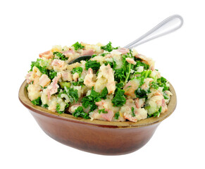 Traditional Irish Colcannon in a rustic earthenware dish, Colcannon is made with mashed potato and kale or cabbage, isolated on a white background