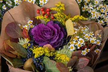 Beautiful bouquet of fresh cut decorative brassica oleracea or flowering kale and other autumn...