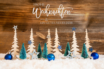 Christmas Trees With German Frohe Weihnachten Und Ein Gutes Neues Means Merry Christmas And A Happy New Year. Christmas Decoration Like Blue Star And Balls. Brown Rustic Background With Snow.