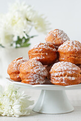 
Sweet deep fried small homemade balls donuts on a platter
