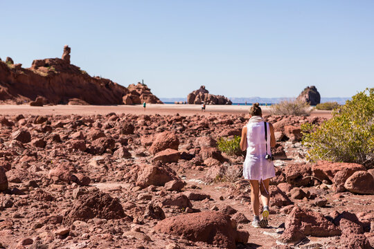Woman hiking near the Sea of Cortes, also known as the Gulf of California, Mexico.