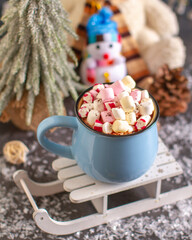 A cup of hot chocolate with marshmallows