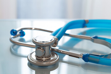 Stethoscope or phonendoscope a blue background.