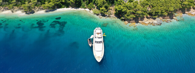 Aerial drone ultra wide panoramic photo of luxury yacht anchored in tropical exotic island with...